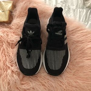 Black and silver adidas sneakers